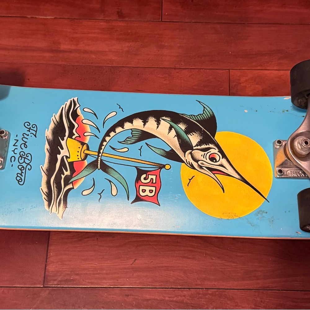 Blue Skateboard with Marlin Design